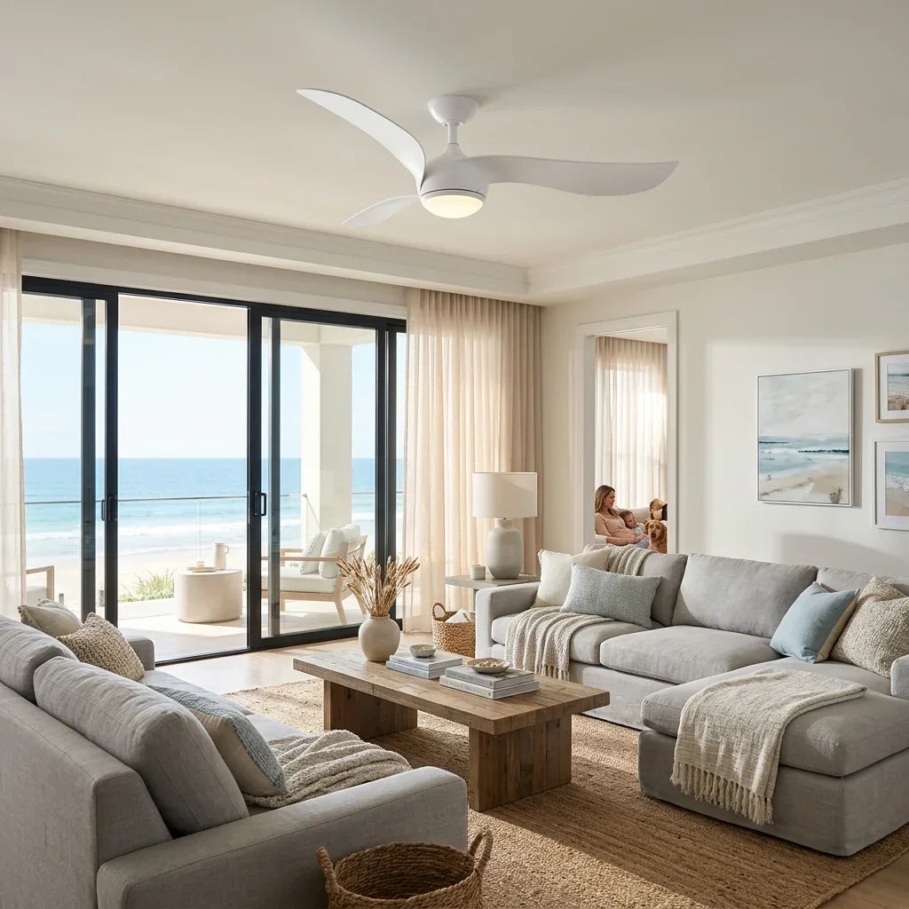 Modern white three-blade ceiling fan with integrated light fixture in a bright living room.
