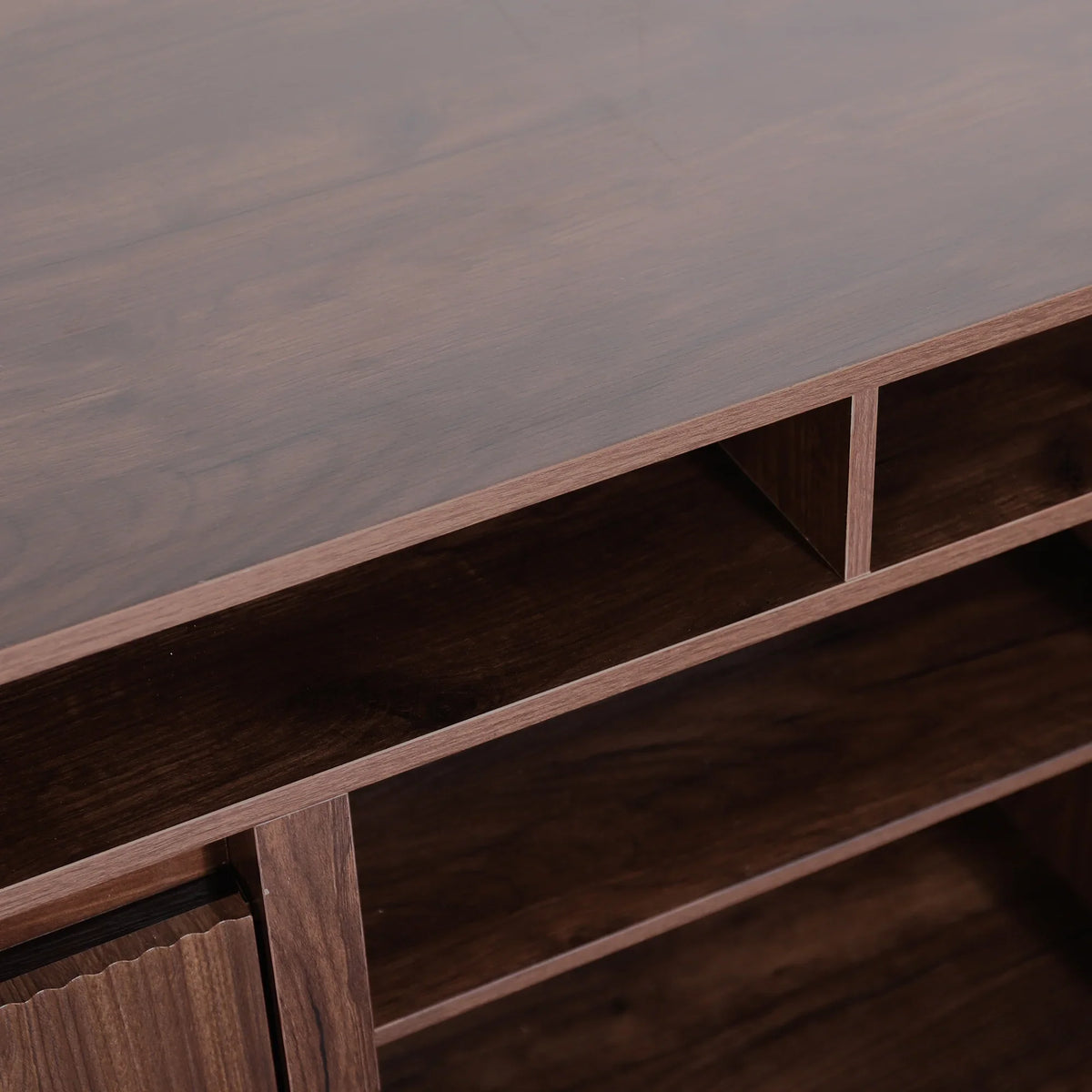 Close-up of a dark walnut wood entertainment center with open shelving